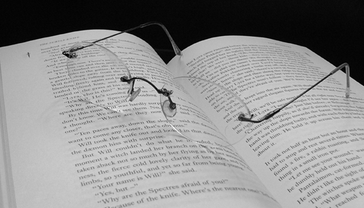 Glasses on open book