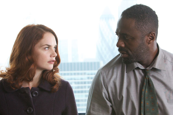 Detective Chief Inspector Luther, played by Idris Elba, sits with Alice Morgan, played by Ruth Wilson
