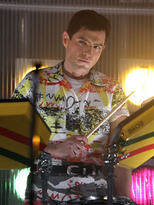 Mathew Horne as Jon Moss playing the drums for a Culture Club live appearance