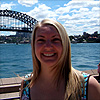 A photo of 5 live reporter Anna Foster standing in front of the Sydney Harbour Bridge