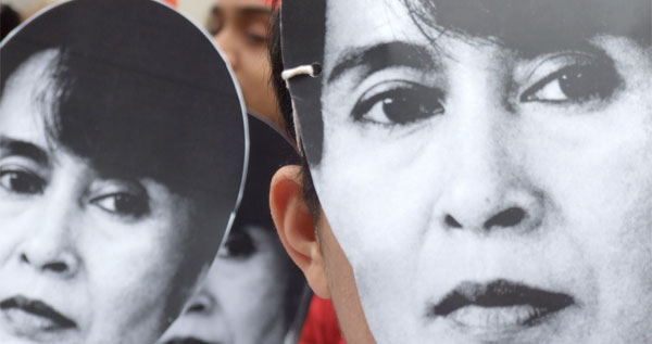 Activists wearing Aung San Suu Kyi masks outside the Chinese Embassy in London in 2007.