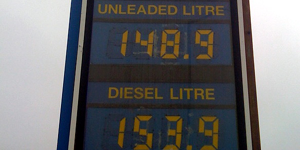 A sign in a petrol station advertising unleaded fuel at £148.9 per litre