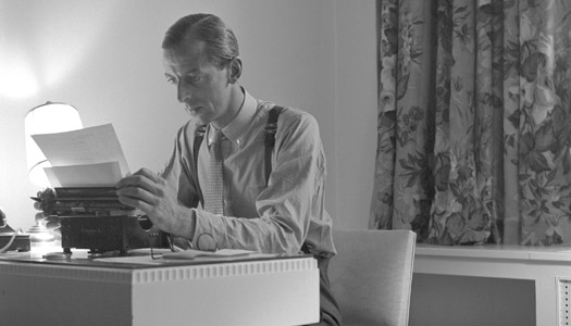 Alistair Cooke typing