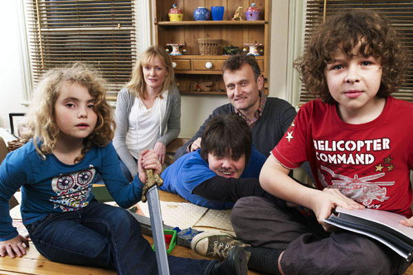 The cast of Outnumbered around the table in the family home