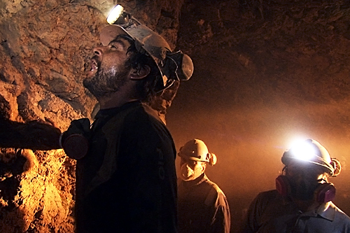 A reconstruction of the Chilean Miners searching for a way out of the mine
