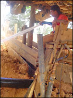 Man washing dirt out of gold 