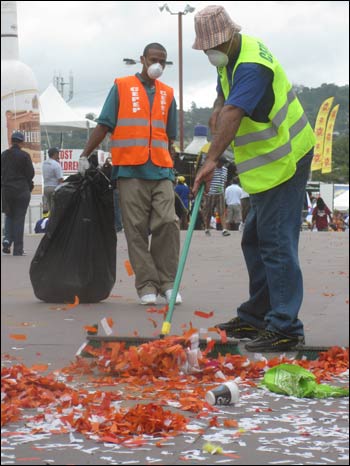 men sweeping the stage