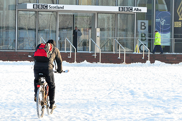 Cycling on the snow outside BBC Scotland, Glasgow