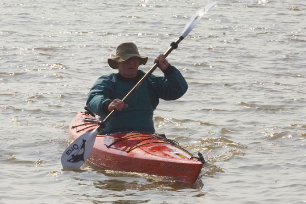 Bernard Hill as the canoe man paddles out to sea