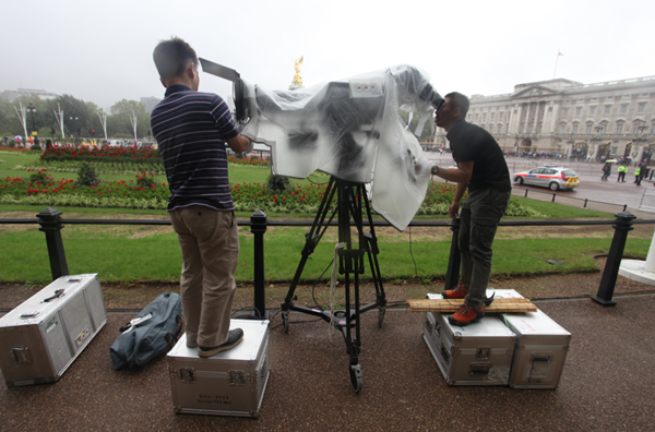 NHK cameramen make final adjustments to a super hi-vision camera used to gather material for special screenings in London, Glasgow and Bradford. 