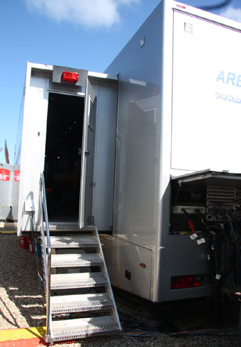 silver story developer truck with dark doorway