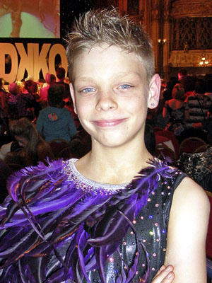 Jimmy dressed as in his bright purple dance costume outfit