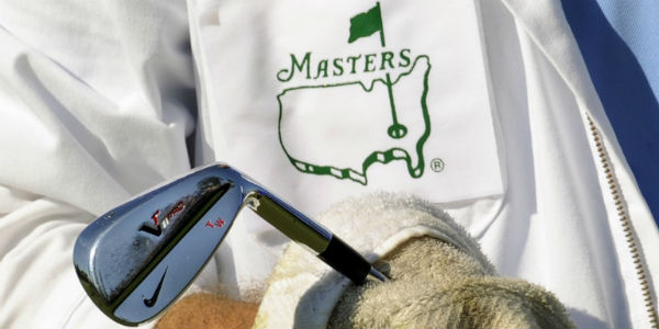 The Masters 2012 - a caddie cleaning a golf club
