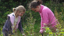 Two girls gardening
