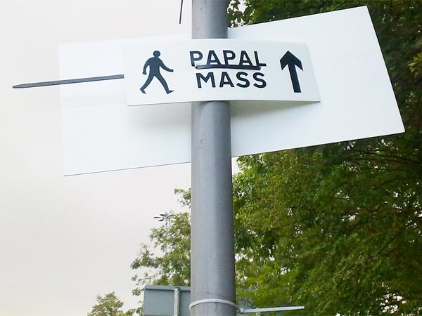 Signs are going up around Bellahouston Park in advance of the Mass