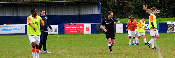 George Riley on the pitch refereeing his first match