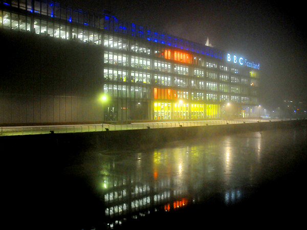 View of BBC Scotland reflected on the frozen River Clyde, 8 January 2010