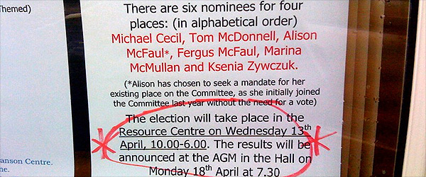 A sign in a shop window giving details of the people standing in the committee which negotiates policies with the Northern Ireland Executive