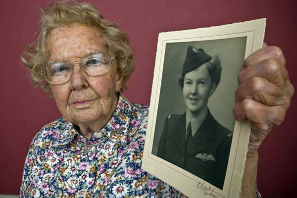 Margaret Frost with a picture of her younger self in the ATA